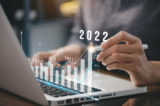 Businessman plan business growth and financial, increase of positive indicators in the year 2022 to increase business growth and an increase for growing up business "n